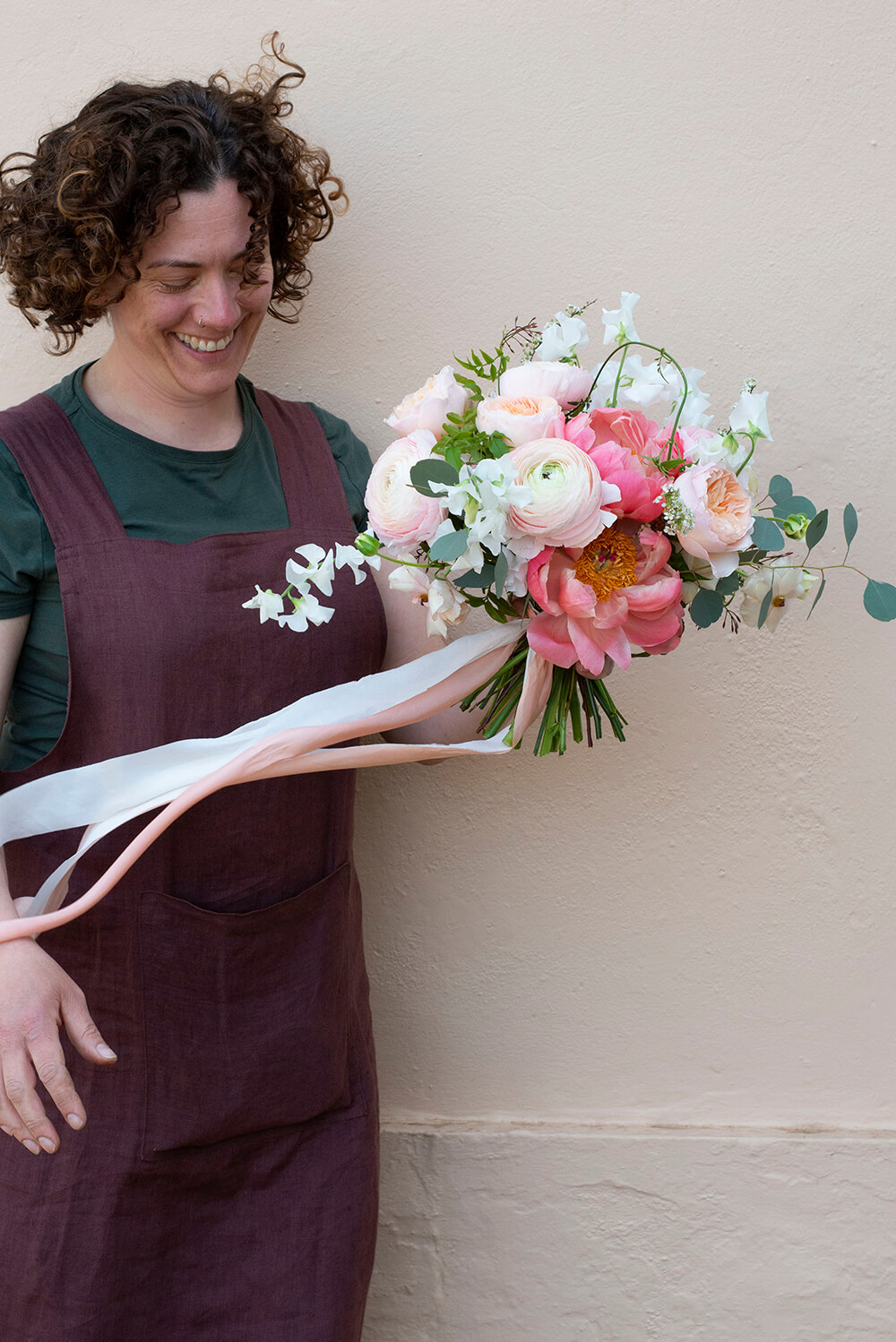 Georgina Chapman holding bouquet pink flower bouquet