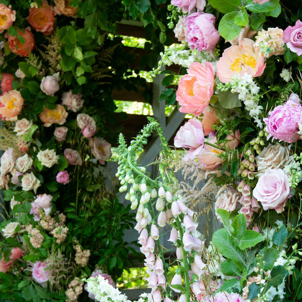 L and T wedding foxgloves and peony arch