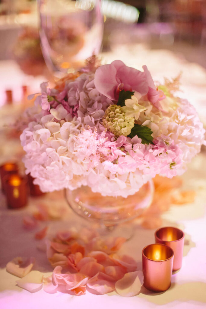 Pink wedding table hydrangea and orchid arrangement