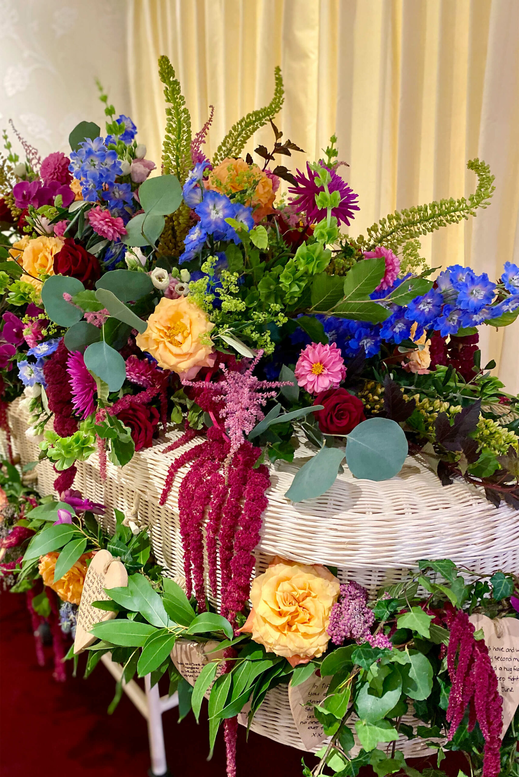 Whicker casket floral arrangement