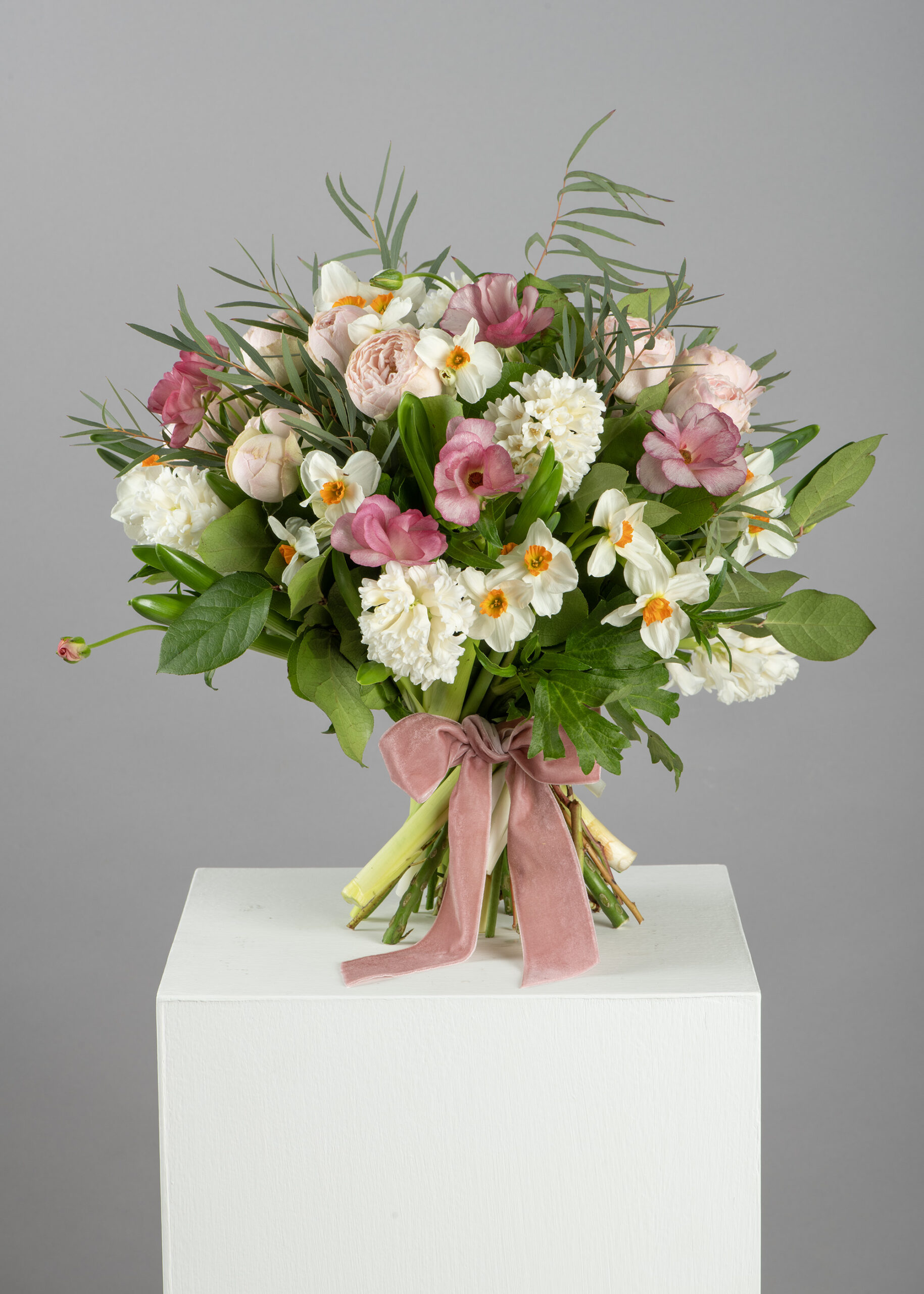 Spring hand tied bouquet in pinks, creams and green