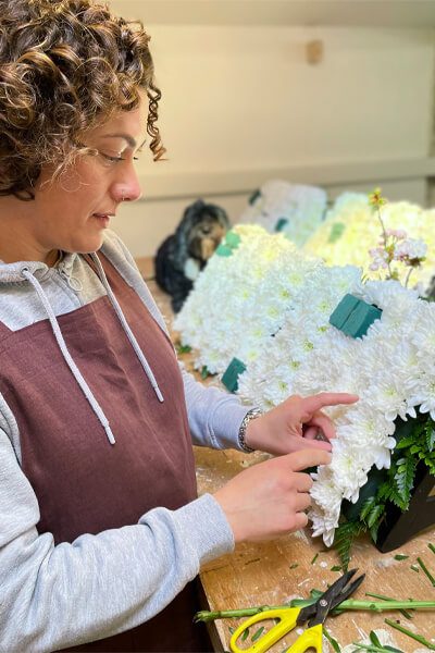 Georgina Chapman making a farewell floral arrangement