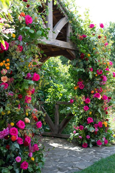 Wooden arch with roses and dahlias